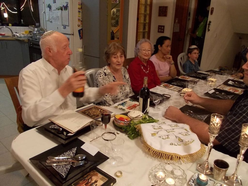 my own family starting the seder nightwith the filling of wine glasses